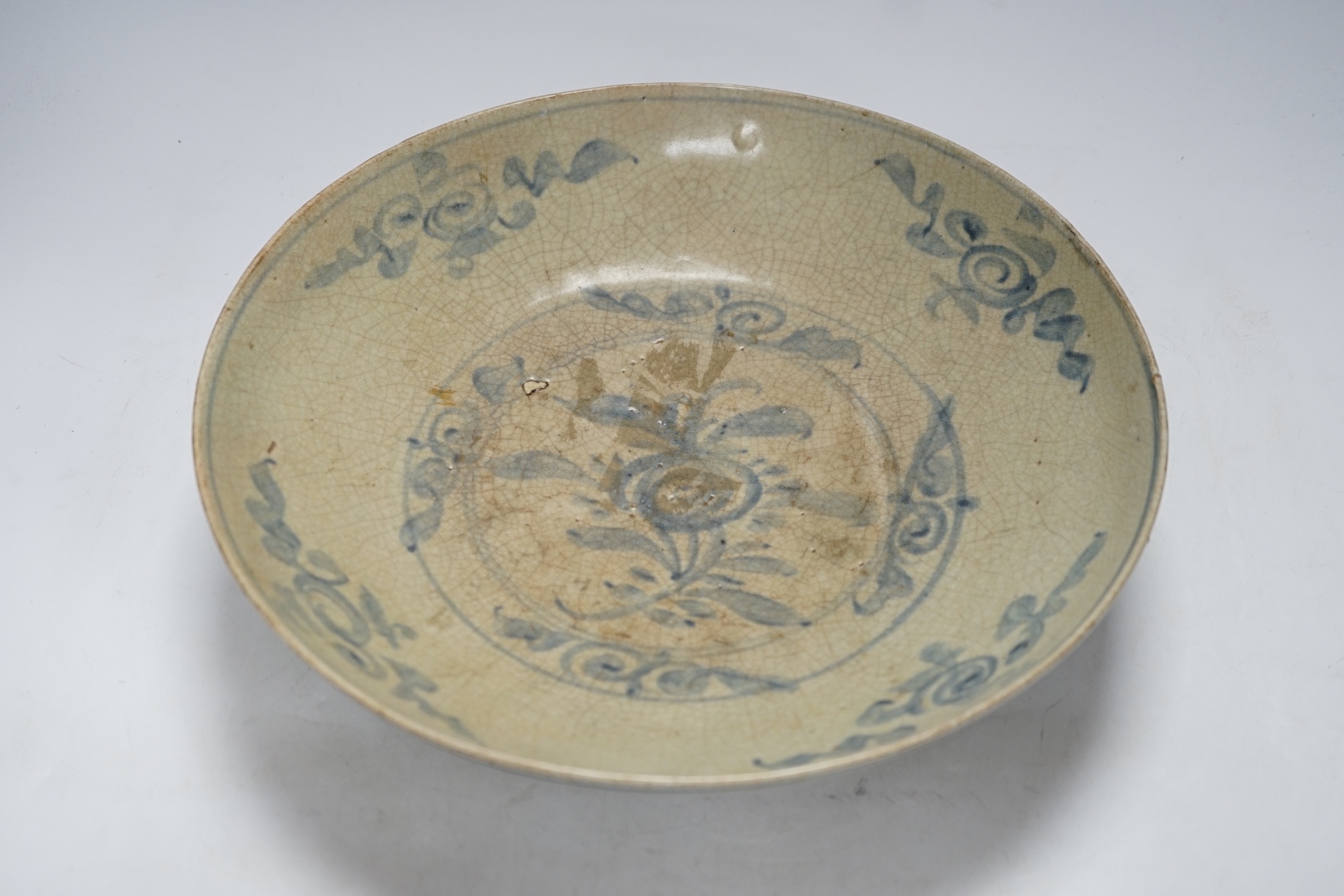 A Chinese Swatow blue and white dish, 17th century, 32cm diameter